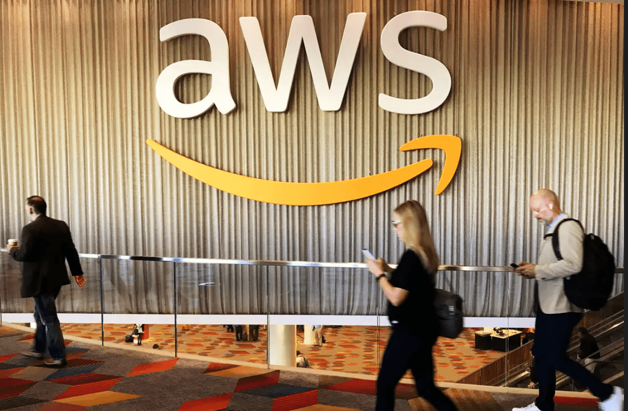 Accendings AWS Logo with man and a lady walking